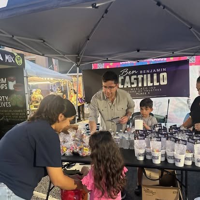 Ben Castillo handing out treats to families