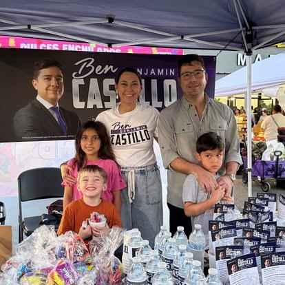 Ben Castillo with his wife and children at a campaign booth